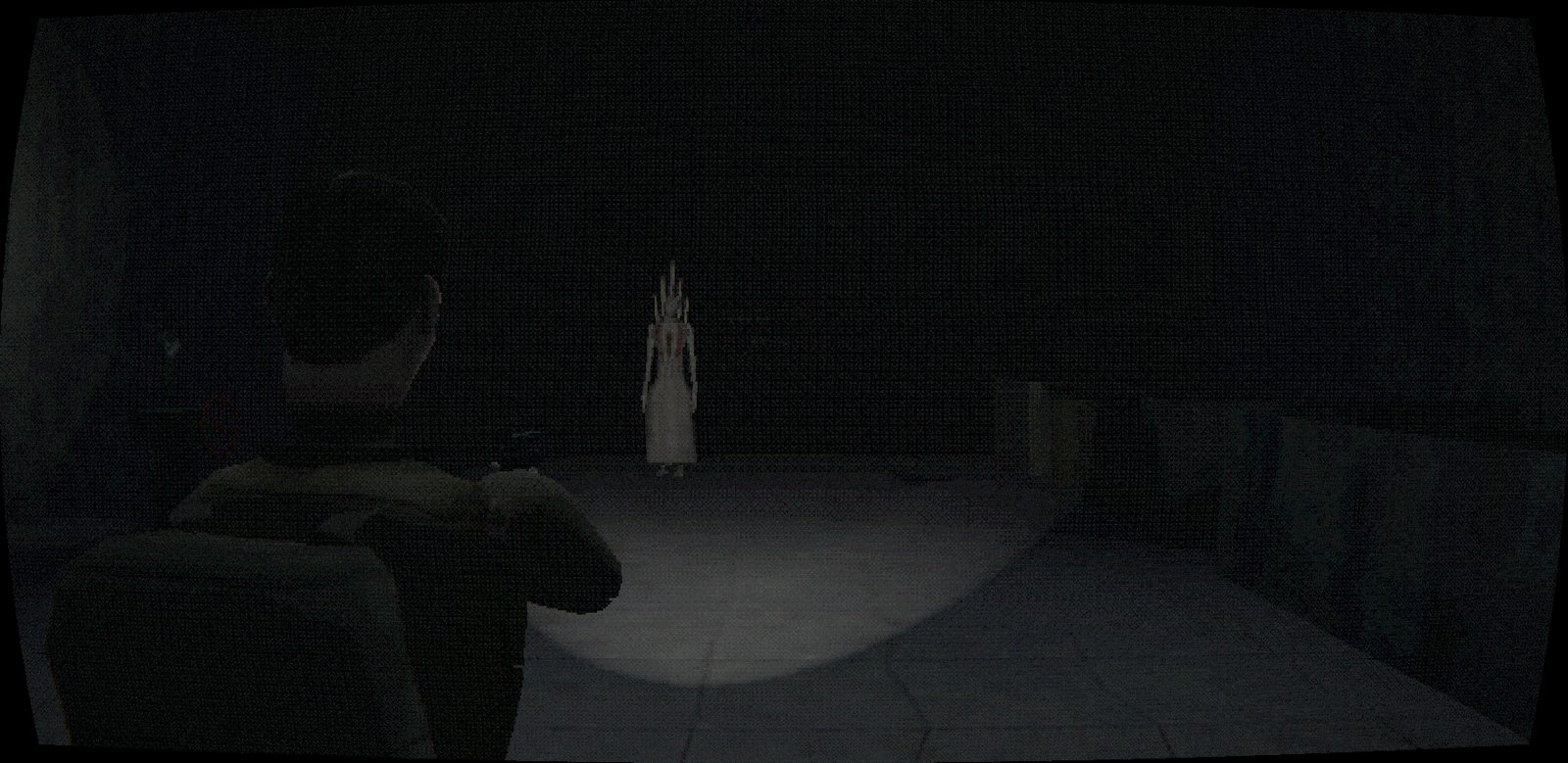 A tall pale figure standing at the edge of a flashlight beam in a dark hall