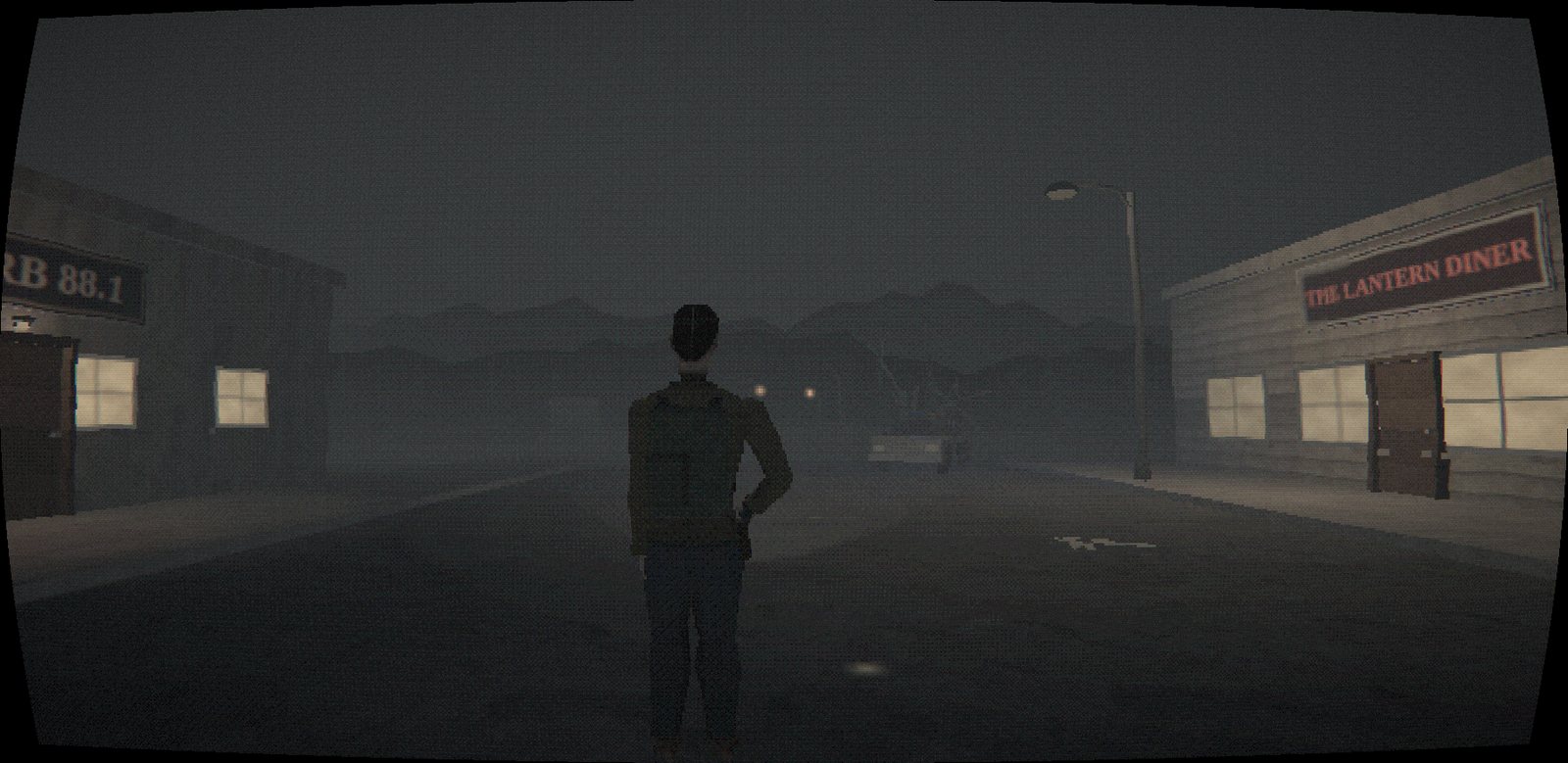 Elias standing in a fog-filled main street at night, the WCRB 88.1 radio station on the left and the lit Lantern Diner on the right